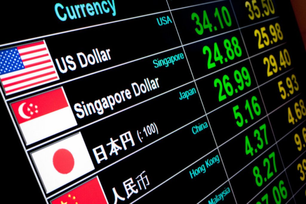 Exchange rate board showing various different currency rates including USD, SGD, JPY. 