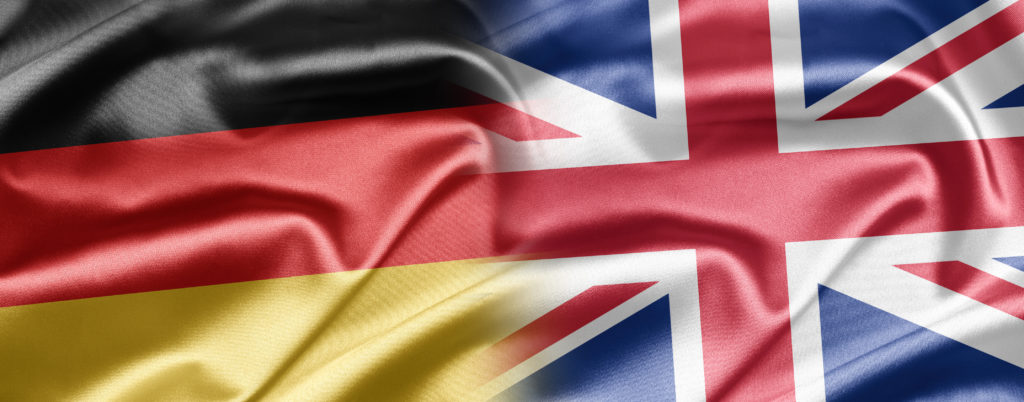 The flag of Germany and the flag of Great Britain side by side. 
