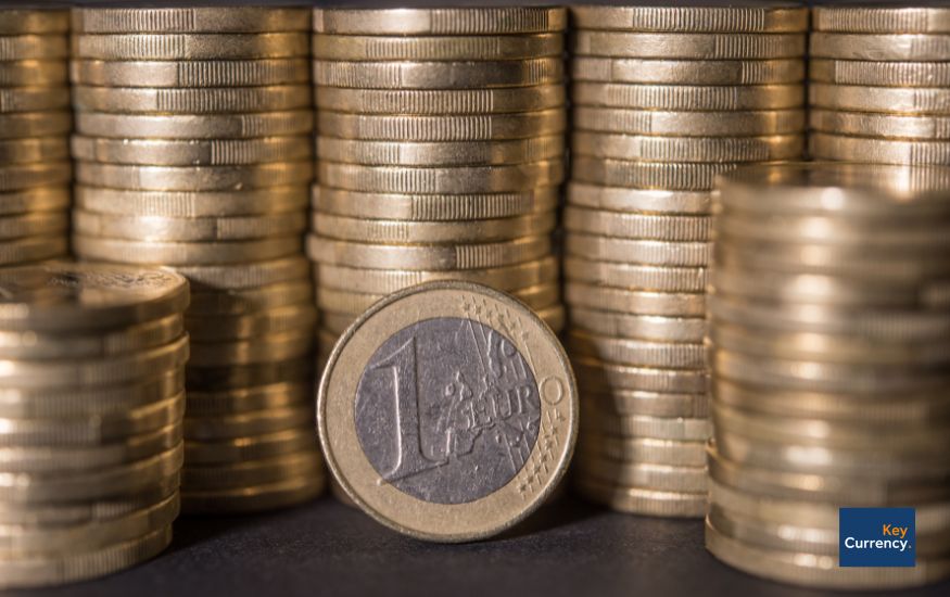 Euro coins stacked on top of each other in a close-up photo. 