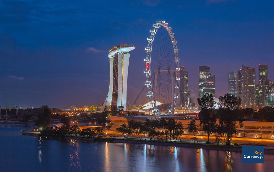 Night time photo of the Singapore flyer, in Singapore. 