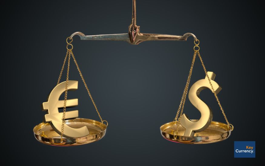 A scale with gold Euro and Dollar symbols on either side to represent the ever changing exchange rate