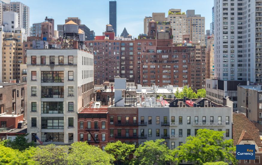 Overview photograph of apartment buildings in central New York on a sunny day. 