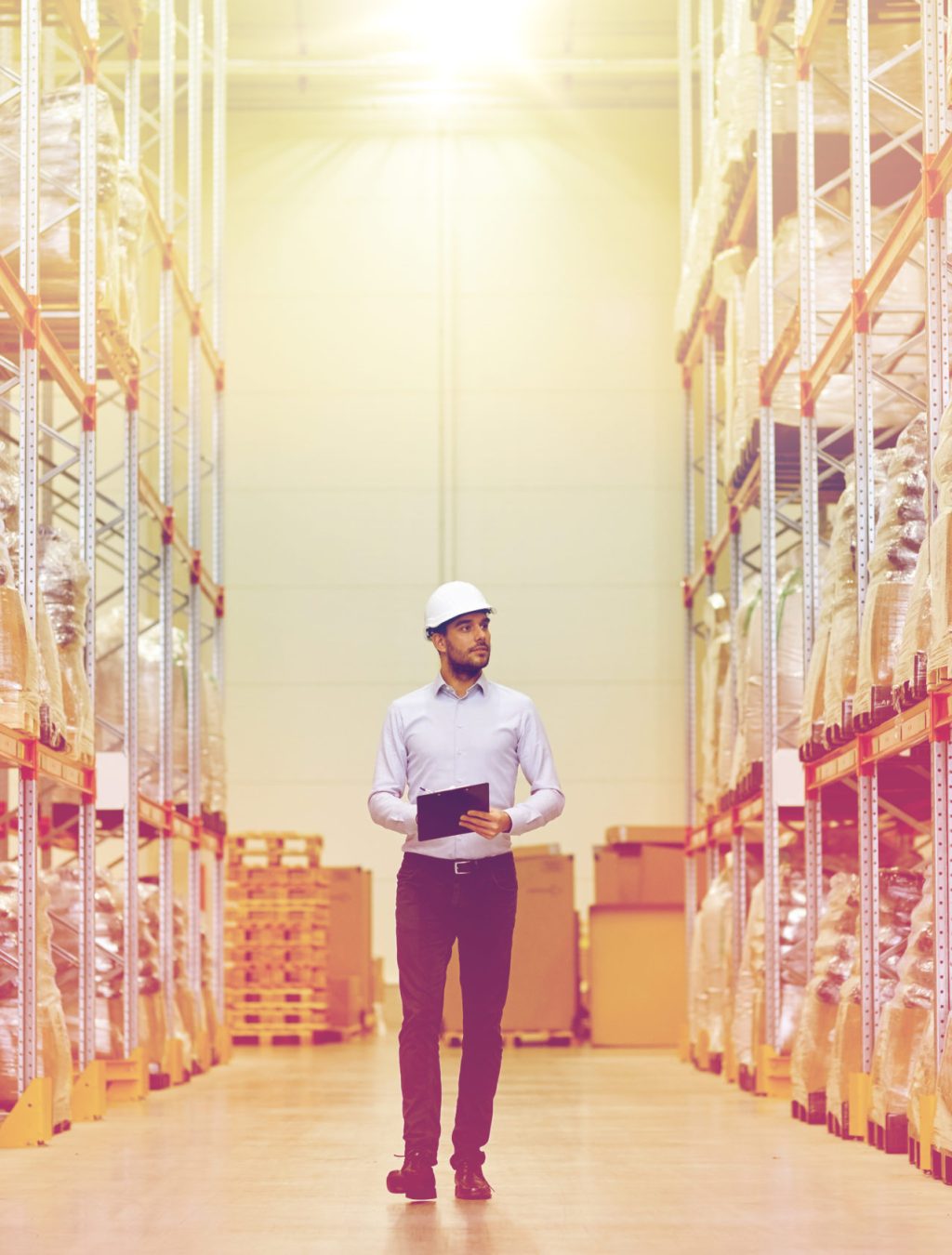 wholesale, logistic, business, export and people concept - happy man or manager with clipboard checking goods at warehouse